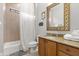 Bathroom with a shower-tub combo and a vanity featuring granite countertops at 781 Golden Bear Dr, Kissimmee, FL 34747