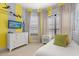 Bright bedroom featuring a playful Peter Pan theme, with a beach scene playing on the television at 781 Golden Bear Dr, Kissimmee, FL 34747
