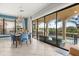 Dining area with large sliding glass doors leading to a covered patio and pool at 781 Golden Bear Dr, Kissimmee, FL 34747