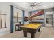 Game room with pool table and wall decor at 781 Golden Bear Dr, Kissimmee, FL 34747