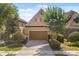 Charming home featuring a two-car garage, neat landscaping, and a brick driveway at 781 Golden Bear Dr, Kissimmee, FL 34747
