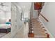Hallway with stairs leading upstairs, bedroom to the left, and living area straight ahead at 781 Golden Bear Dr, Kissimmee, FL 34747