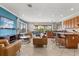Open-concept living room featuring tile floors and an island counter with barstool seating at 781 Golden Bear Dr, Kissimmee, FL 34747
