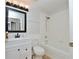 Updated bathroom features a bathtub with shower, a vanity with a sink and a black framed mirror at 847 Orista Dr, Davenport, FL 33897