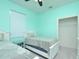 Cozy bedroom with two twin beds features mint walls, carpet, and a closet with shelving at 847 Orista Dr, Davenport, FL 33897
