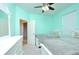 Comfortable bedroom with two twin beds features mint walls, carpet, and a view to the door at 847 Orista Dr, Davenport, FL 33897