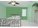 Bedroom with unique metal bed frame, neutral paint, and plush carpeting with access to walk in closet at 847 Orista Dr, Davenport, FL 33897