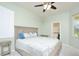 Bright bedroom with ensuite bathroom featuring neutral paint and soft natural light from the window at 847 Orista Dr, Davenport, FL 33897