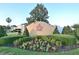 Beautiful community entrance with landscaped foliage and colorful floral arrangements at 847 Orista Dr, Davenport, FL 33897
