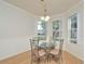 Cozy dining room with bay window, white wainscotting, and a charming chandelier at 847 Orista Dr, Davenport, FL 33897