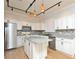 Spacious kitchen with white cabinets, granite countertops, and stainless steel appliances at 847 Orista Dr, Davenport, FL 33897