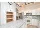 Well-lit kitchen with white cabinets, stainless steel appliances, and granite countertops at 847 Orista Dr, Davenport, FL 33897