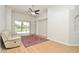 Bright living room with hardwood floors, neutral walls, and a view of the backyard pool through sliding glass doors at 847 Orista Dr, Davenport, FL 33897