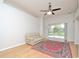 Bright living room with sliding glass doors overlooking a pool and a red oriental rug at 847 Orista Dr, Davenport, FL 33897