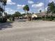 Gated community entrance with manicured landscaping at 88 Club Villas Ln, Kissimmee, FL 34744
