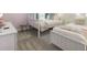 Bedroom offering two twin beds with soft blankets in a light and bright space at 9118 Sommerset Hills Dr, Davenport, FL 33896