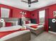 Charming bedroom with two beds, ceiling fan, and fun Mickey Mouse decor at 9118 Sommerset Hills Dr, Davenport, FL 33896