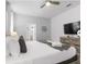 Cozy bedroom featuring a bed, dresser, ceiling fan, and modern decor at 9118 Sommerset Hills Dr, Davenport, FL 33896