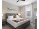 Relaxing bedroom with a ceiling fan, natural light, and soft, neutral tones at 9118 Sommerset Hills Dr, Davenport, FL 33896