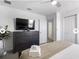 Bright bedroom features a bed, dresser, and modern decor at 9118 Sommerset Hills Dr, Davenport, FL 33896