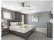 Lovely bedroom featuring a bed, ceiling fan, and elegant decor at 9118 Sommerset Hills Dr, Davenport, FL 33896