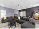 Recreational game room with ping pong table, arcade games, and a sectional sofa at 9118 Sommerset Hills Dr, Davenport, FL 33896