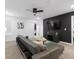 Stylish living room featuring a sofa, mounted TV, and modern decor at 9118 Sommerset Hills Dr, Davenport, FL 33896
