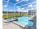 A large pool with an integrated spa and sun loungers, perfect for relaxation and outdoor enjoyment at 9118 Sommerset Hills Dr, Davenport, FL 33896