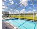 A large pool with an integrated spa and sun loungers, perfect for relaxation and outdoor enjoyment at 9118 Sommerset Hills Dr, Davenport, FL 33896