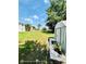 A spacious backyard featuring a lush green lawn, mature trees, and a shed for extra storage at 467 Martigues Drive, Kissimmee, FL 34759
