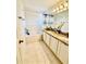 Well-lit bathroom with double vanity, granite countertops, and a shower-tub combo for added convenience at 467 Martigues Drive, Kissimmee, FL 34759