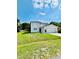 Charming two-story home with a well-manicured lawn and a two-car garage, located on a sunny street at 467 Martigues Drive, Kissimmee, FL 34759