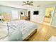 Bedroom with ceiling fan, large windows, and stylish furnishings offers a comfortable and inviting space at 467 Martigues Drive, Kissimmee, FL 34759