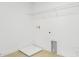 Bright laundry room featuring wood floor, shelving, and washer/dryer hook ups at 1027 Cloud Ridge Ct, Mount Dora, FL 32757