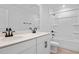Bright bathroom with a double vanity, modern fixtures, and a combined bathtub and shower at 1035 Cloud Ridge Ct, Mount Dora, FL 32757
