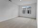 Bright bedroom with plush carpeting, recessed lighting, and windows offering ample natural light at 1035 Cloud Ridge Ct, Mount Dora, FL 32757
