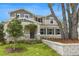 Beautiful two-story home featuring stone accents, manicured landscaping, and a welcoming front porch at 1035 Cloud Ridge Ct, Mount Dora, FL 32757