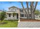 Beautiful two-story home featuring stone accents, manicured landscaping, and a welcoming front porch at 1035 Cloud Ridge Ct, Mount Dora, FL 32757