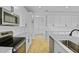 Bright and spacious kitchen featuring stainless steel appliances, white cabinets, and an island sink at 1035 Cloud Ridge Ct, Mount Dora, FL 32757