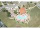An aerial image of the community pool and playground amenities, offering recreational opportunities at 1043 Tourmaline Dr, Kissimmee, FL 34746