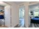 Hallway featuring gray vinyl flooring and doorway views of the bedroom and walk in closet at 1043 Tourmaline Dr, Kissimmee, FL 34746