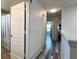 Bright hallway showcasing modern flooring and access to rooms at 1043 Tourmaline Dr, Kissimmee, FL 34746