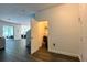 Interior view featuring an open floor plan, sleek flooring, and a conveniently located storage closet in the hallway at 1043 Tourmaline Dr, Kissimmee, FL 34746