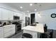 Modern kitchen with stainless steel appliances, white cabinets, and a spacious island at 1043 Tourmaline Dr, Kissimmee, FL 34746