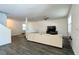 Bright living room with wood-look tile, neutral paint and furnishings, and a modern ceiling fan at 1043 Tourmaline Dr, Kissimmee, FL 34746