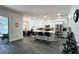 Open-concept living room and kitchen with a view of the patio and pool area at 1043 Tourmaline Dr, Kissimmee, FL 34746