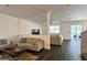 Open-concept living room with hard surface floors, neutral paint, and sliding doors to the backyard at 1043 Tourmaline Dr, Kissimmee, FL 34746