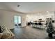 Bright, open-concept living room and kitchen featuring modern finishes and stainless steel appliances at 1043 Tourmaline Dr, Kissimmee, FL 34746