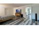 Spacious main bedroom features wood-look floors and access to a bright hallway at 1043 Tourmaline Dr, Kissimmee, FL 34746