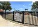 Community playground with safety signage and a variety of play equipment for children at 1043 Tourmaline Dr, Kissimmee, FL 34746